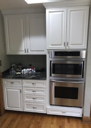 All of the cabinets around the ovens in the kitchen were repainted. Preview Image 4