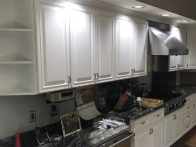 The main set of kitchen cabinets by the stove were all painted white.
