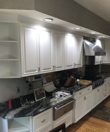 The main set of kitchen cabinets by the stove were all painted white. Preview Image 5