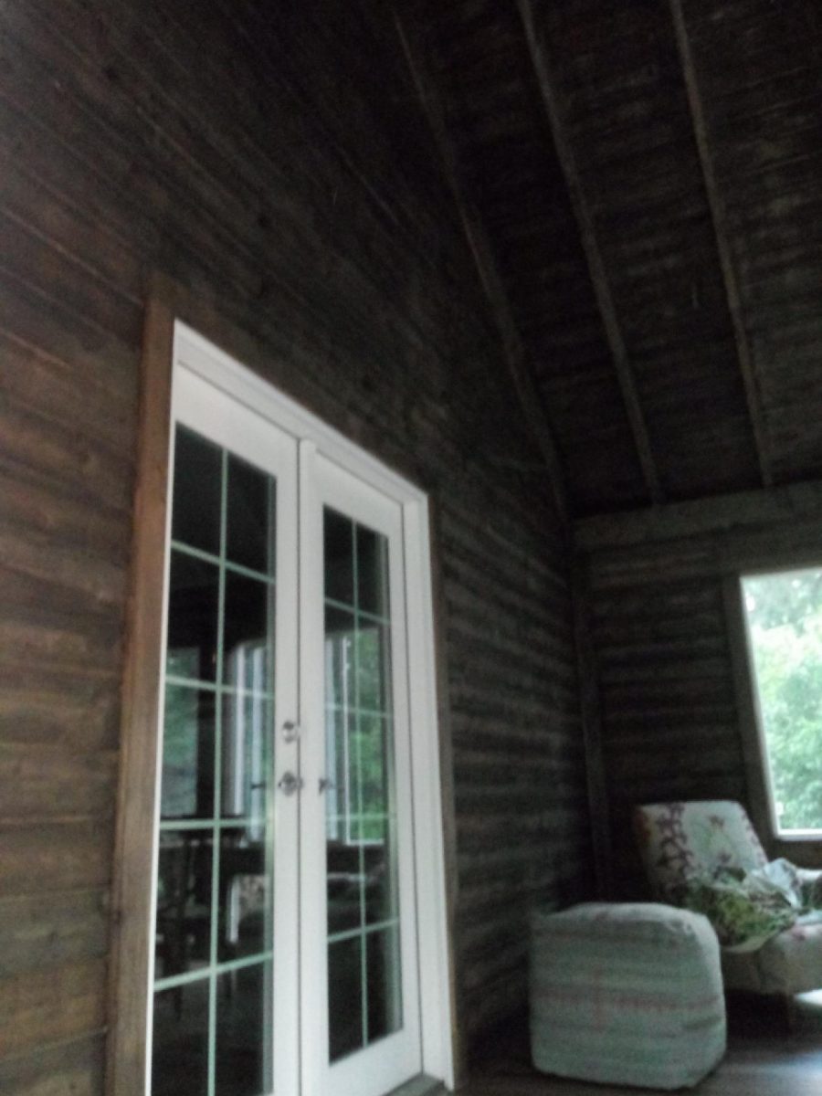 The wood on this porch was stained in a nature inspired dark brown semi-transparent stain. Preview Image 2