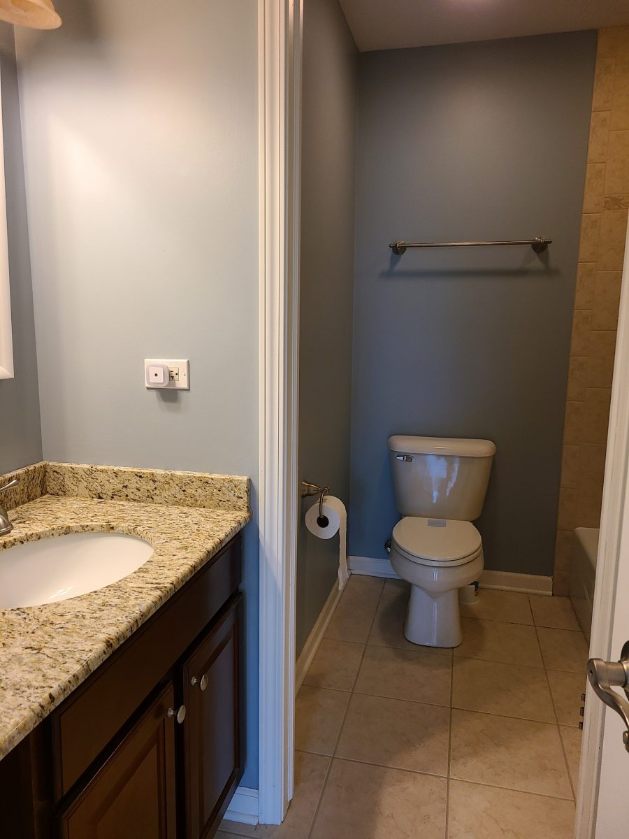 A bathroom repainted with white trim. Preview Image 4