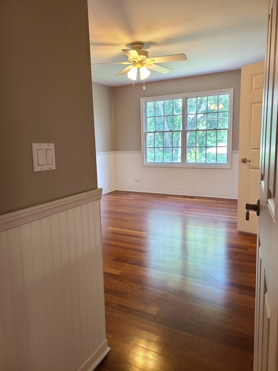 This room was painted beige with white wainscoting and white trim. Preview Image 1