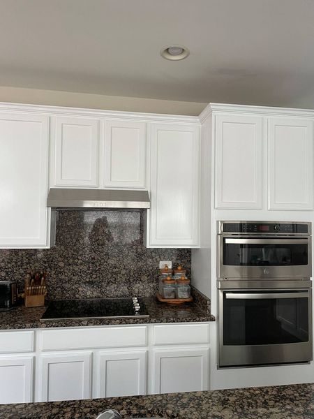 Oak kitchen cabinets refinished in white paint. Preview Image 1