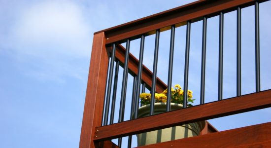 Deck staining services completed railing