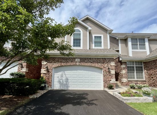 driveway view of home in hoa community