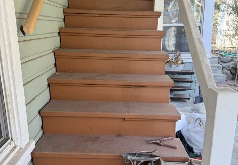 exterior staircase of house before painting
