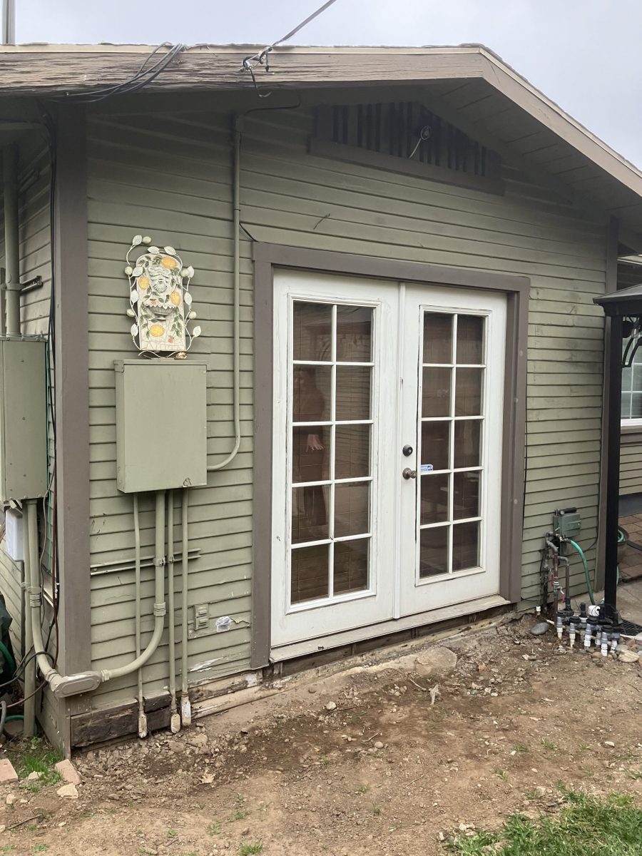french doors of craftsman style house with damaged and worn siding Preview Image 9