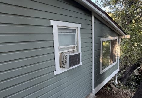 side of house with new light green paint