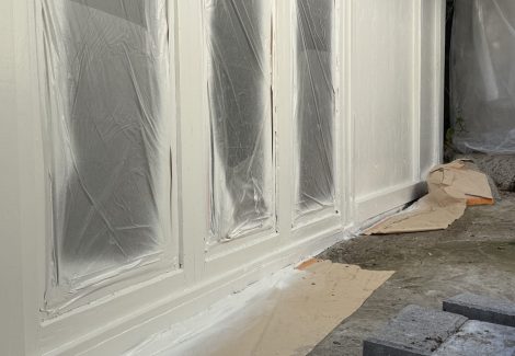 house windows with protective wrap during painting