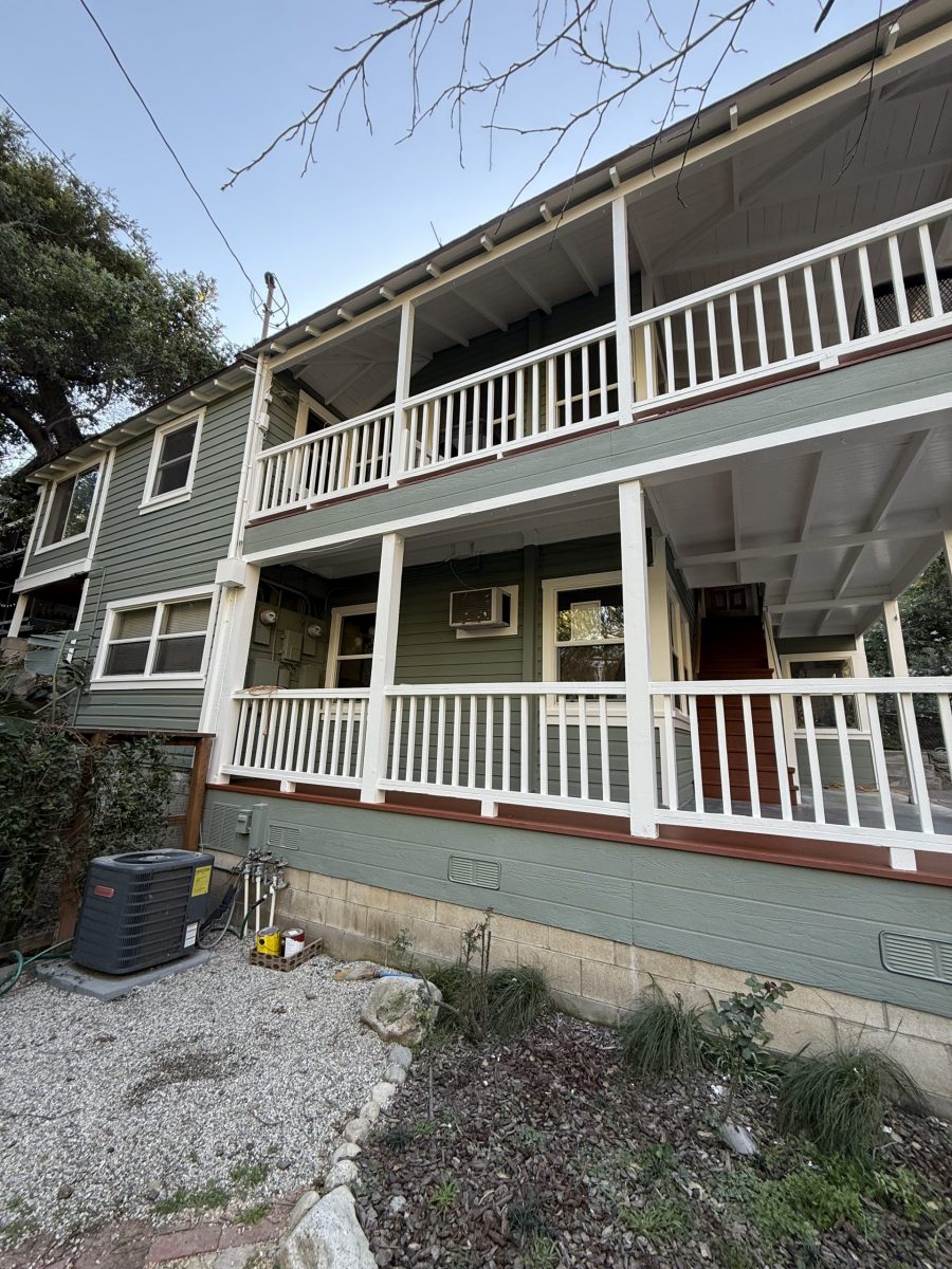 exterior of painted house with white porch railings on upper and lower level Preview Image 11