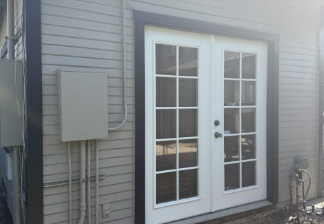 side door of painted house with black trim