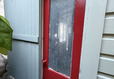 red painted door on home