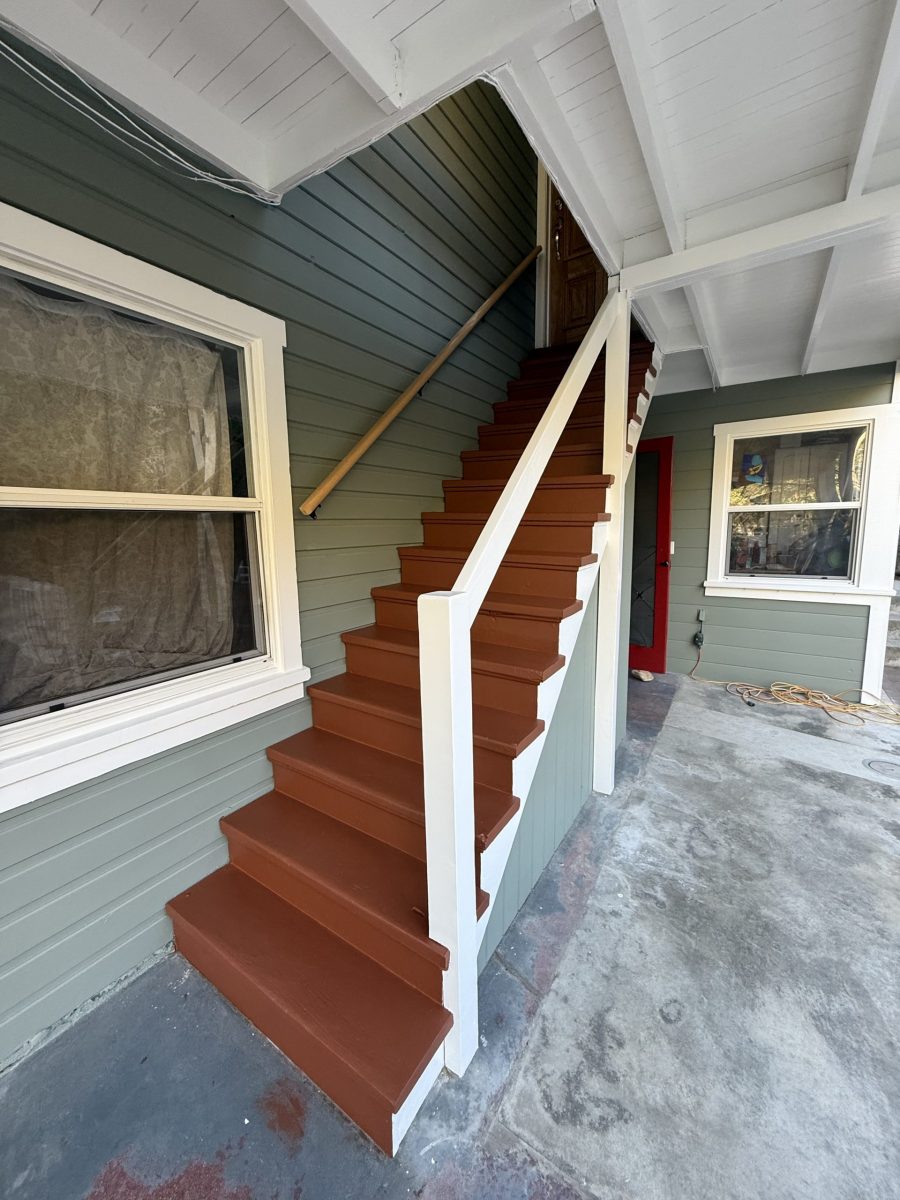 covered exterior staircase of house with fresh paint Preview Image 9