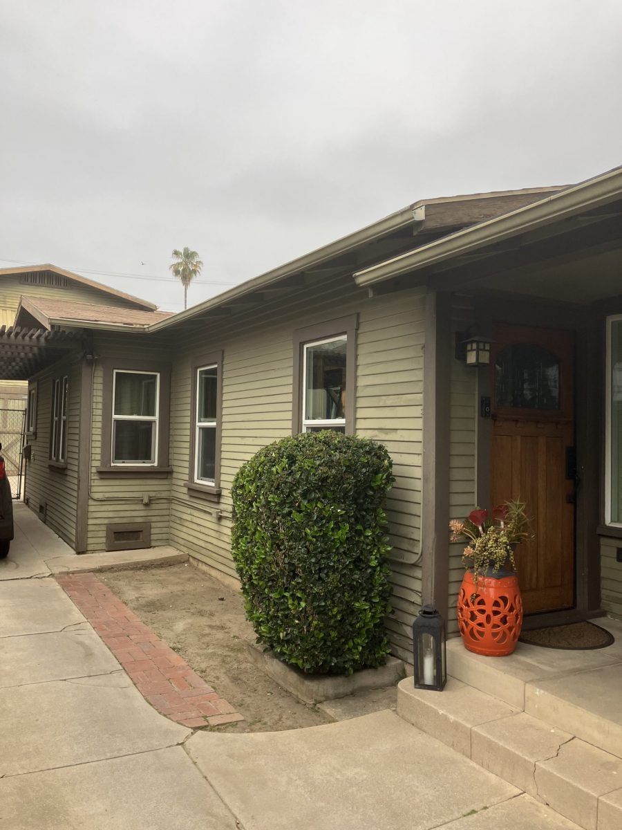 front and side view of house with damaged and worn siding Preview Image 8