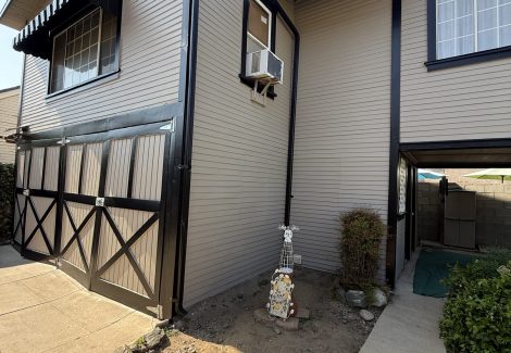 rear view of painted house with dark trim