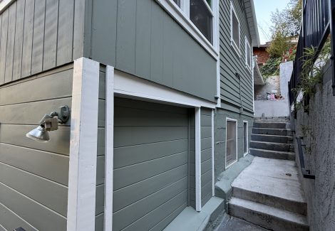 side of house with new light green paint and white trim