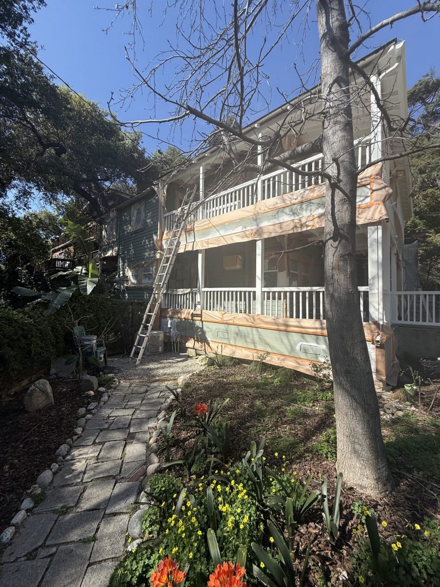 house with protective wrap during painting Preview Image 21