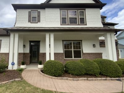 Front of white house in Fairburn, GA after completed residential exterior painting project by CertaPro Painters of Peachtree City/Coweta County, GA