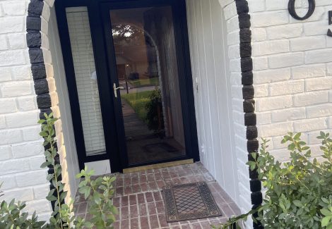 brick entry way white and black painting