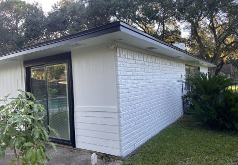 brick exterior rear view white and black painting