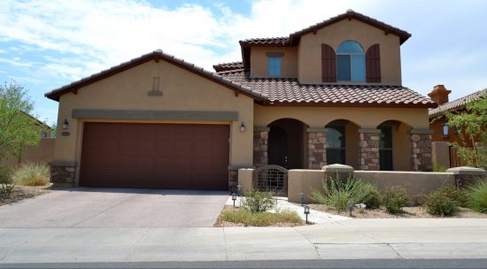 traditional tan colors used for the paint scheme of this stucco home.