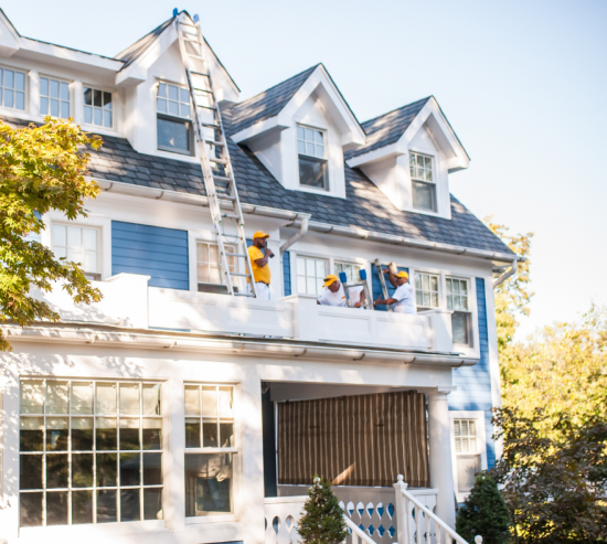 Blue siding exterior with certapro painters paint crew