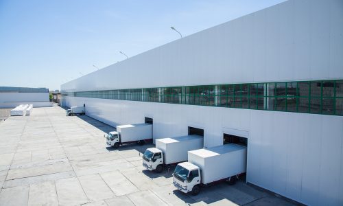 Facade,Of,An,Industrial,Building,And,Warehouse,With,Freight,Cars