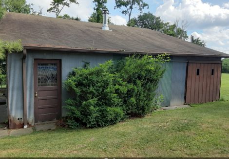 Door and trim in need of restoration