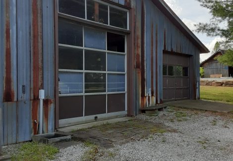 Two garage doors in disrepair