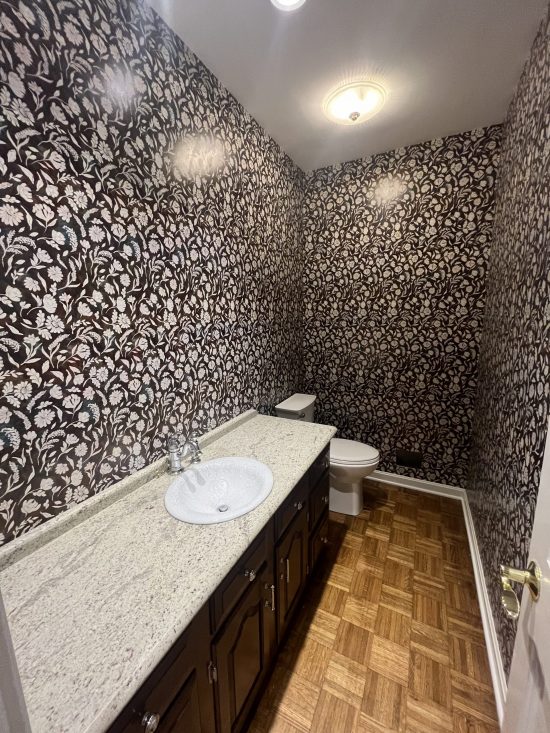 home bathroom with wallpaper