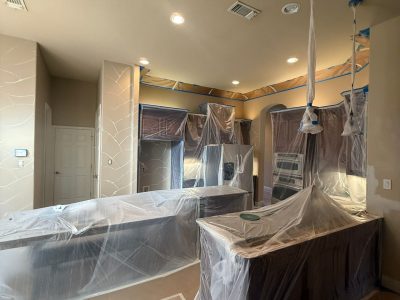 kitchen with protective coverings for painting