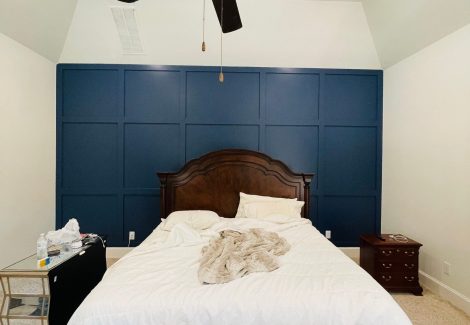 bedroom with blue accent wall