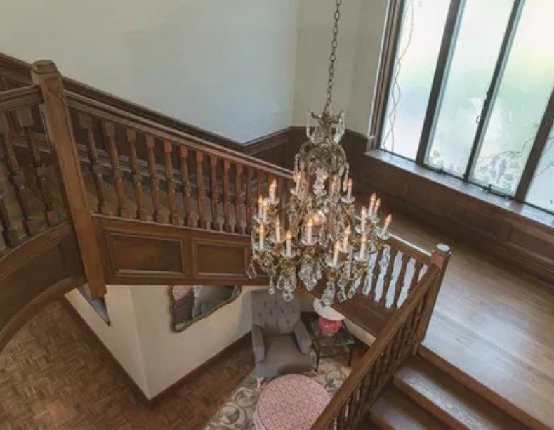 wooden spiral staircase and chandelier Preview Image 3