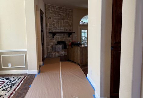 home interior with protective coverings for painting