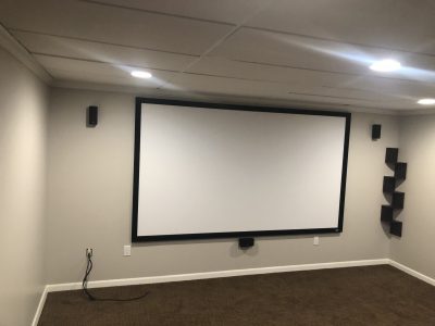 projector in refinished basement