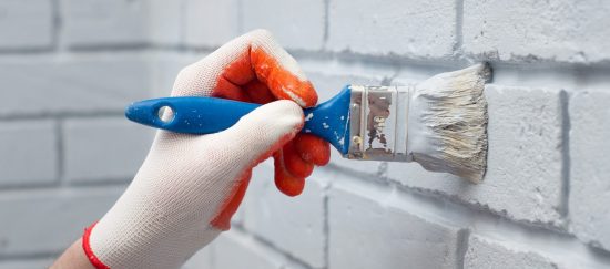 Brick being painted white