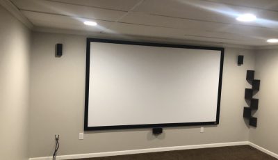 projector in refinished basement