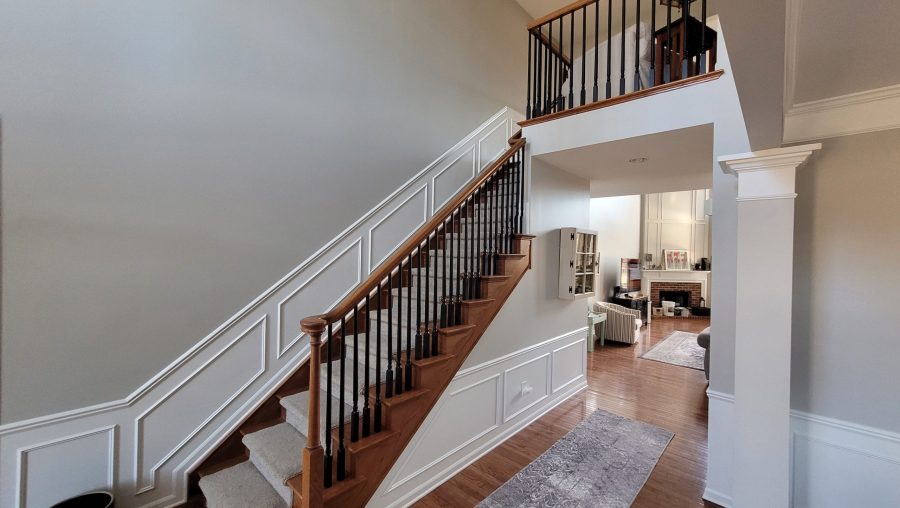 home staircase with spindles painted black