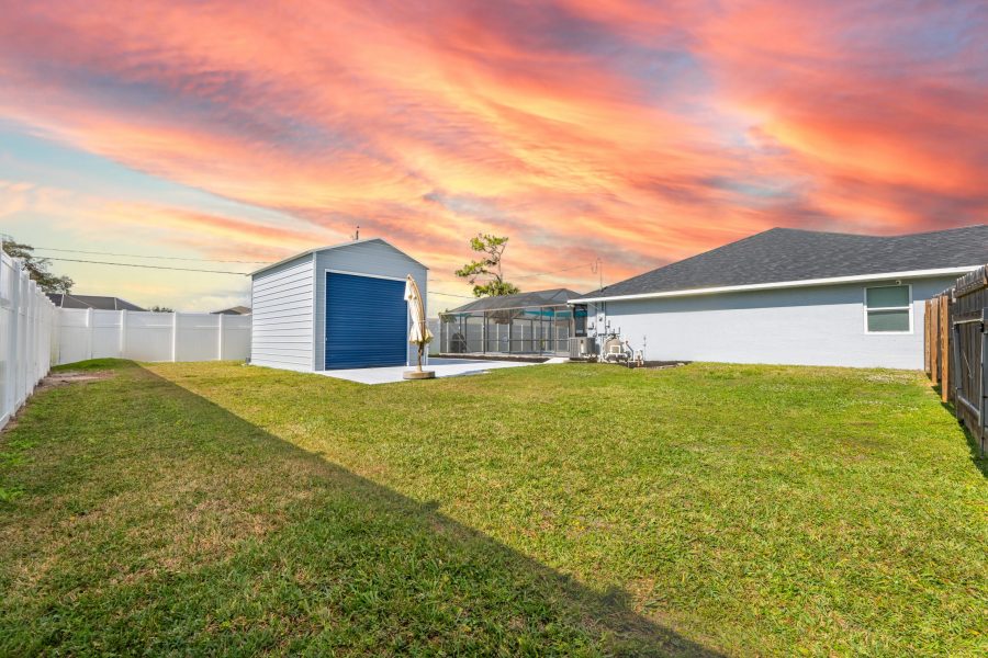 A shed freshly painted gray and blue Preview Image 5