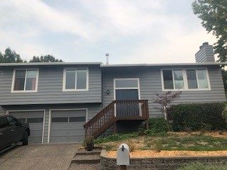 Fully repainted exterior of a raised ranch in Beaverton.