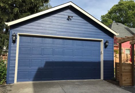 Exterior garage door painting by CertaPro house painters in Portland, OR
