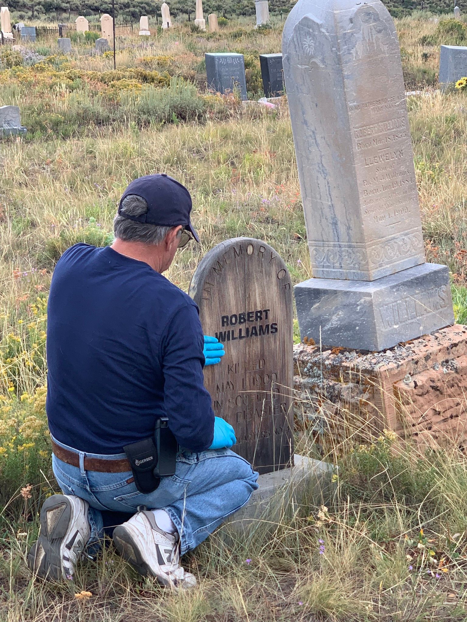 a man staining a grave