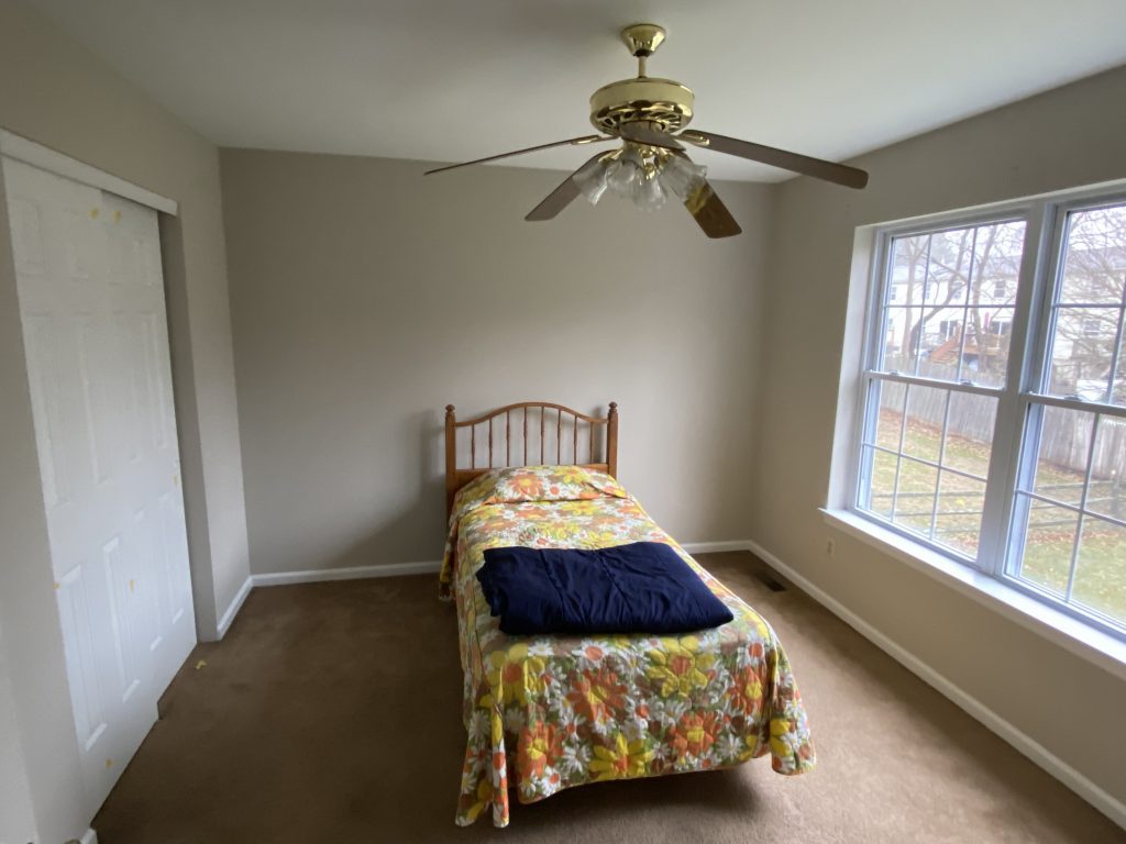 tan walls in carpeted bedroom