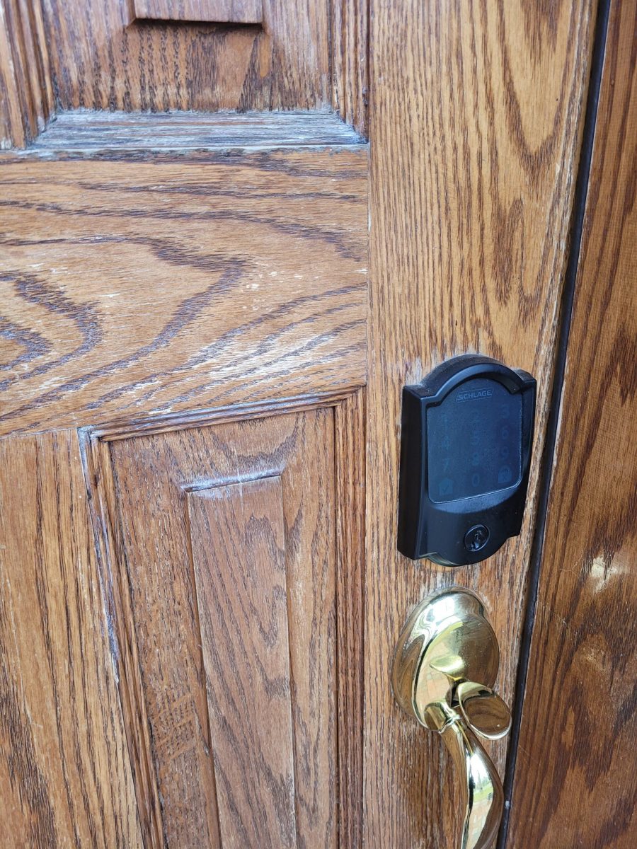close up of wooden front door with worn stain Preview Image 2