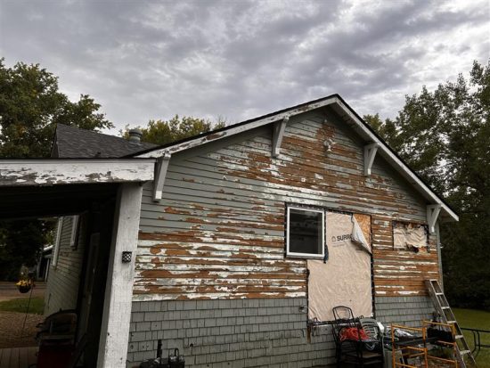 house exterior with damaged paint