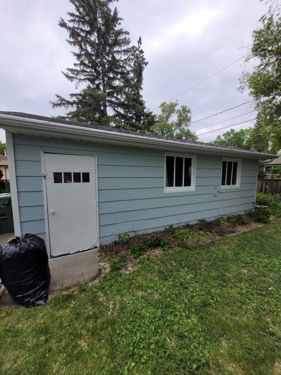 side of blue painted house Preview Image 1