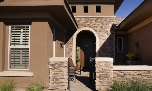 a classic stucco, stone and trim combo