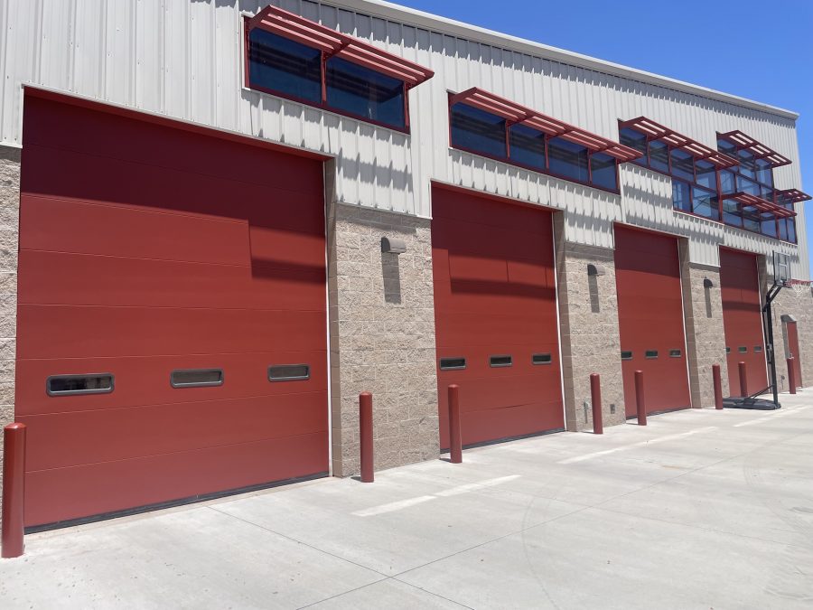 fire station with tan siding and dark red bay doors Preview Image 1