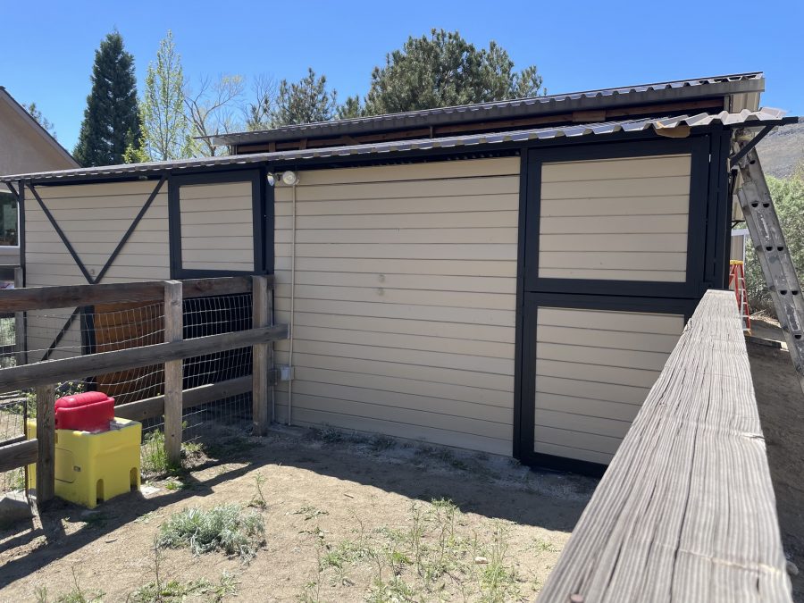 residential barn outbuilding with tan siding and black trim Preview Image 2