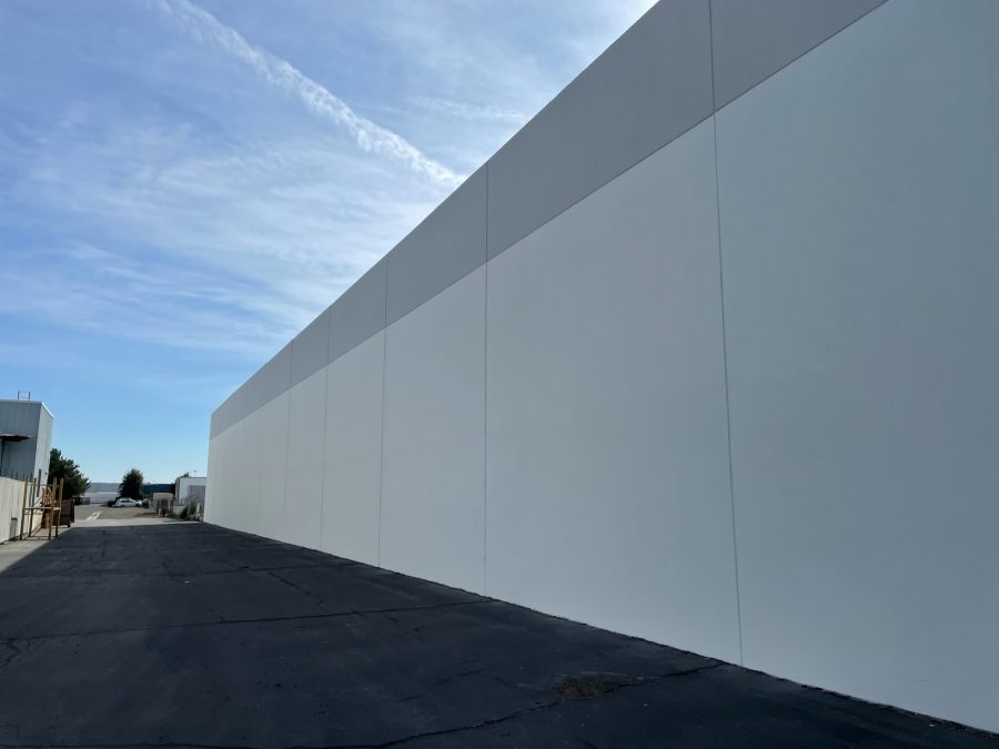Long exterior block wall painted by CertaPro of Reno. Preview Image 3